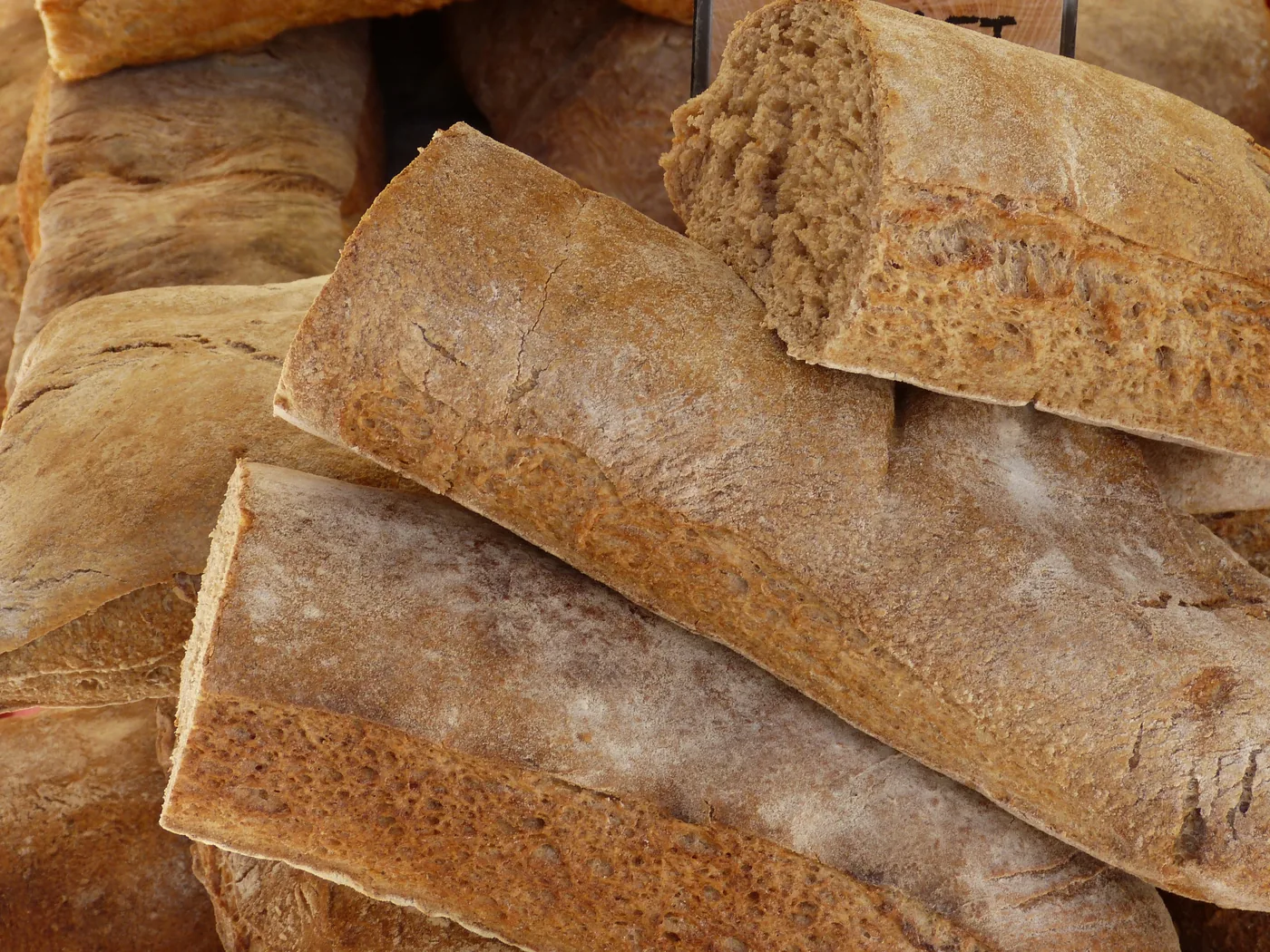 Loaves of country bread on a market stall in Uzès